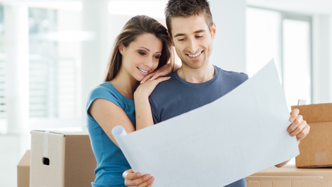Couple-Looking-At-Plans-From-Remodeling-Contractor